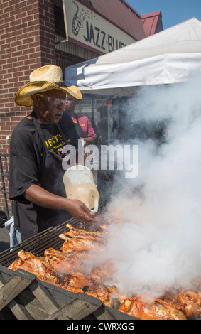 A worker grills ribs at Bert's Marketplace, a restaurant and jazz club in Detroit's Eastern Market Historic District. Stock Photo