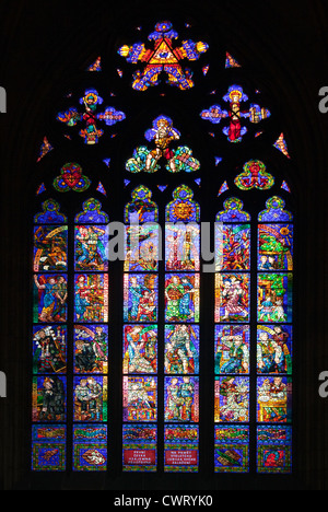 One of many stained glass windows that decorate the individual chapels of  Prague's St. Vitus Cathedral (Katedrala Sv. Vita). Stock Photo