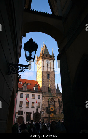 Prague, Czech Republic: A passageway from Melantrichova Street into Old Town Square frames Prague's famed Astronomical Clock. Stock Photo