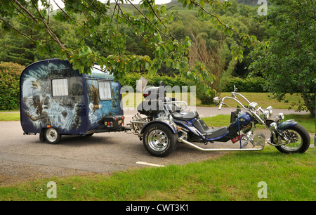 Customised chopper motorbike towing a caravan Stock Photo