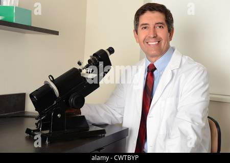 Hispanic Researcher using microphone in laboratory Stock Photo
