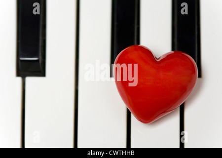 Red heart on a piano Stock Photo