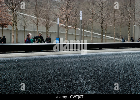 Tourists at the 9/11 Memorial honoring those killed in the September 11, 2001 attacks on the World Trade Center and the Pentagon Stock Photo