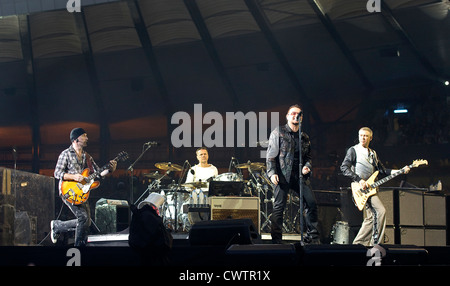 (l-r) The Edge, Larry Mullen Jr, Bono and Adam Clayton performing during The U2 360° Tour at Hampden Park, Glasgow, Scotland. Stock Photo