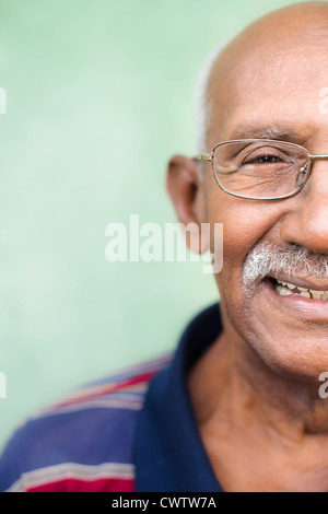 Seniors and feelings, elderly black man with glasses and mustache smiling. Cropped view, copy space Stock Photo