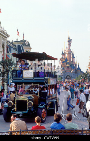 The Castle with Main Street shops, rides and people during daytime in Euro Disneyland at Euro Disney Resort outside Paris Stock Photo