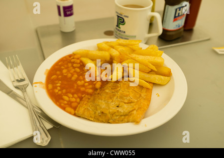 A plate of pasty chips and beans at a greasy spoon truckers cafe, UK Stock Photo