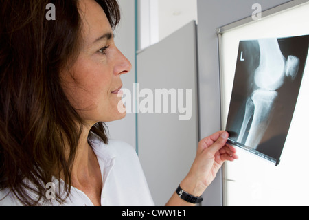 Doctor examining x-rays Stock Photo