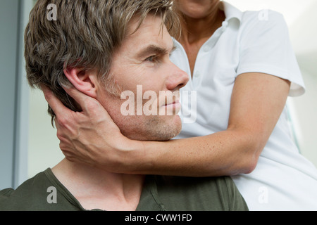 Close up of doctor examining patient Stock Photo