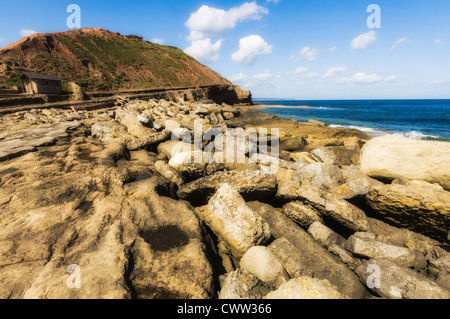 View from tip of Filey Brigg, looking back towards shore, showing Bird Hide. Stock Photo