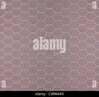 Seamless tileable gray honeycomb background. Brown toned grid. Stock Photo