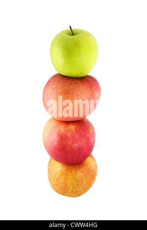 Fresh red apples stacked on top of one another with a green apple on top Stock Photo