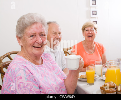 happy senior friends having breakfast together Stock Photo