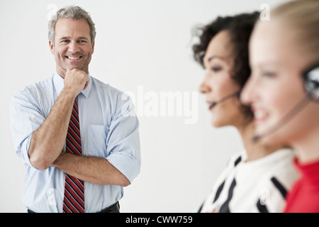 Businesswomen wearing headsets Stock Photo