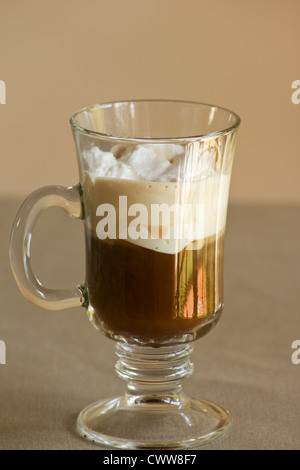Cappuccino in a glass mug Stock Photo