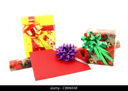 Gift box and roll paper with gift card on white background Stock Photo
