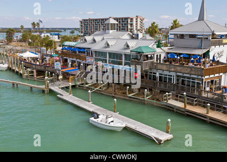 Shops and restaurants on the Treasure Island side of John's Pass on the Gulf Intracoastal Waterway in Florida Stock Photo