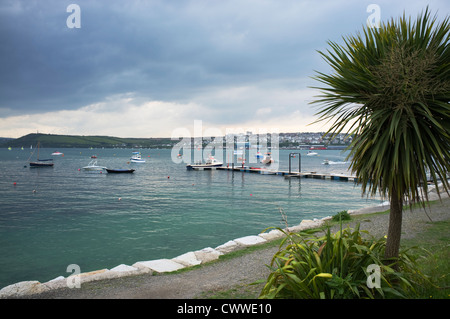 Cornish shrimper boats moored in the distance at the beach, Rock, Cornwall, England, UK. Stock Photo