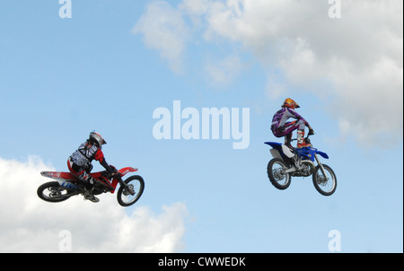 motor bikes  jumping ramps to heights of 35 feet Stock Photo