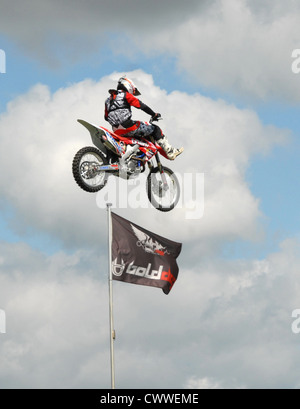 Motor cycles jumping ramps to heights of 35 feet Stock Photo