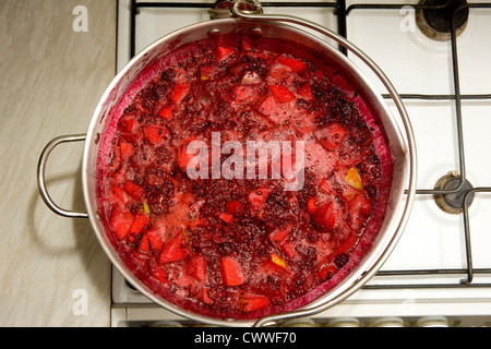 Jam Making - straining fruit through muslin bag to remove seeds ad skins  Stock Photo - Alamy