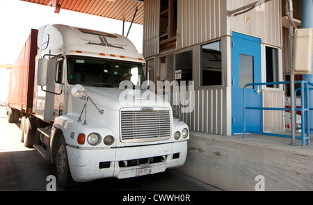 commercial port along the Texas southwest. U.S Customs and Border Protection officers check trucks for possible hidden drugs Stock Photo