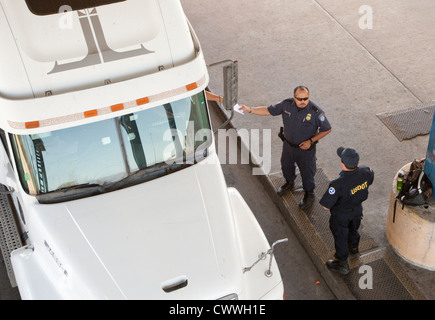 commercial port along the Texas southwest. U.S Customs and Border Protection officers check trucks for possible hidden drugs Stock Photo