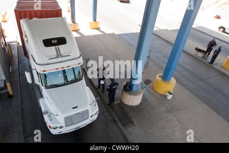 commercial port along the Texas southwest. U.S Customs and Border Protection officers check trucks for possible hidden drugs Stock Photo