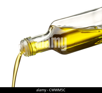 olive oil being poured from glass bottle Stock Photo