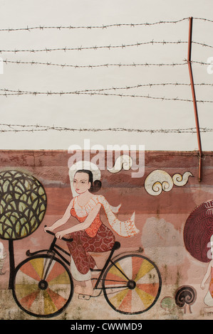 Mae Sot, close to the Burma border. Graffiti on the wall, done by burmese refugees. Stock Photo