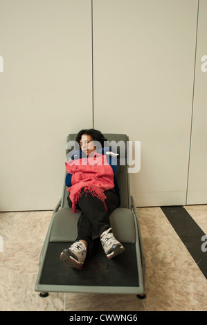 People sleeping at an airport in Ethiopia. Stock Photo