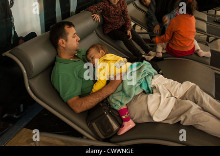 People sleeping at an airport in Ethiopia. Stock Photo