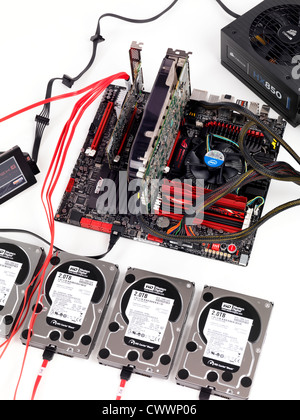 Computer motherboard with four hard drives connected to a RAID controller Stock Photo