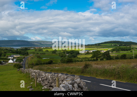 Winding country road in the Burren' region of County Claire, Republic of Ireland. Stock Photo