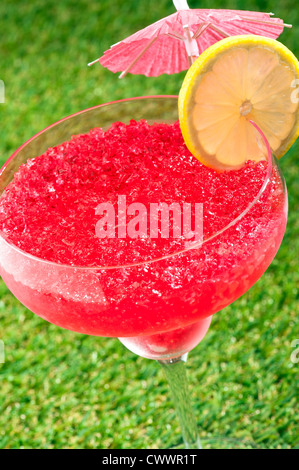 Strawberry Watermelon Daiquiri decorated with lemon and umbrella Stock Photo