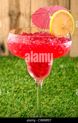 Strawberry Watermelon Daiquiri decorated with lemon and umbrella Stock Photo