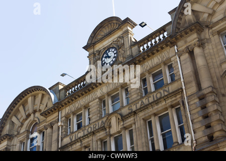 Main facade of Manchester Victoria railway station showing the clock and  Lancashire and Yorkshire Railway inscription. Stock Photo