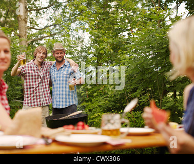 Friends drinking beer outdoors Stock Photo