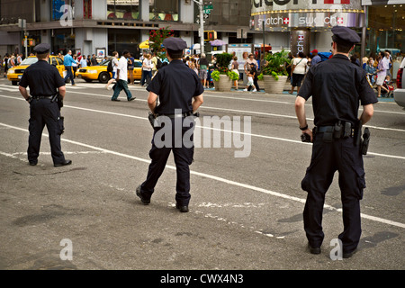 Police officers patrolling Times Square, New York City, USA Stock Photo ...