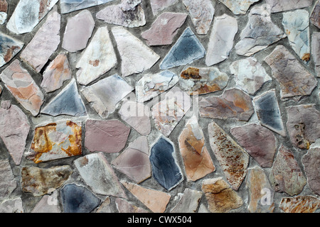 masonry wall with irregular shaped stones Stock Photo