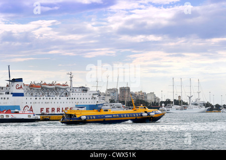 A passenger ferry and flying dolphin serving Aegina and Agistri at the port of Piraeus in Athens Greece Stock Photo