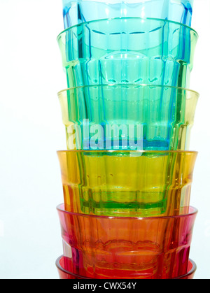 Brightly colored stacked plastic beakers Stock Photo