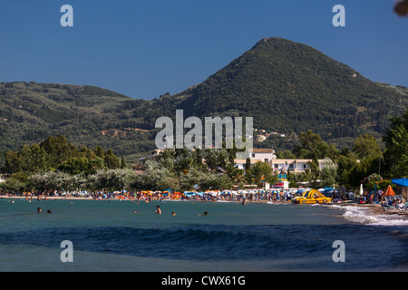 Tourists on a beach in Moraitika, Corfu, Ionian Islands, Greece. Stock Photo