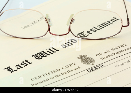 Last Will and Testament document with a Death Certificate and a pair of metal rimmed reading glasses Stock Photo
