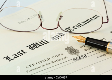 Last Will and Testament official document with a Death Certificate, a pair of metal rimmed reading glasses and a fountain pen for signing. England UK Stock Photo