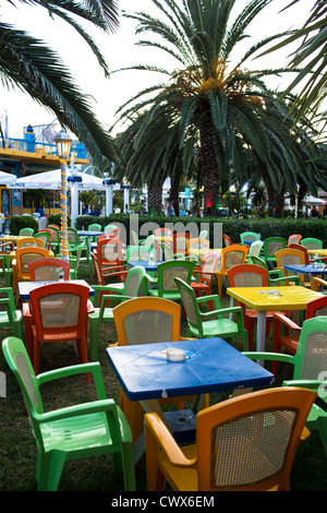 Empty plastic chairs in a beach café in Moraitika, Corfu, Ionian Islands, Greece. Stock Photo