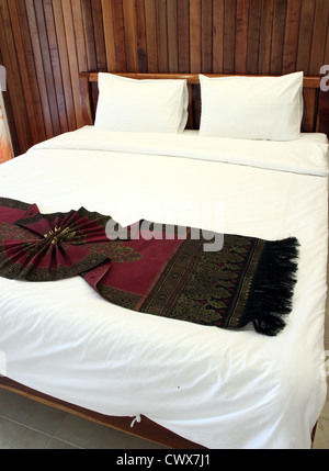 Beautiful double bed in traditional Thai setting Stock Photo