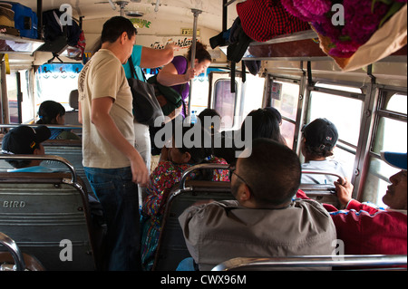 Guatemala, Antigua. Riding a chicken bus in Antigua, Guatemala. Stock Photo
