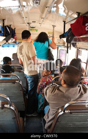 Guatemala, Antigua. Riding a chicken bus in Antigua, Guatemala. Stock Photo