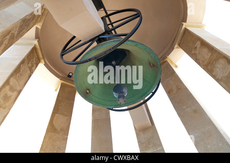 Looking up at the bell in the Siege Bell Memorial erected in 1992 overlooking the Great Harbour of Valletta Island of Malta Stock Photo